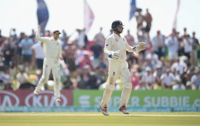 England wicket keeper Ben Foakes celebrates with Joe Root after stumping Dinesh Chandimal