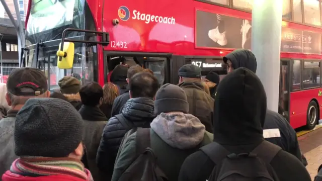 People boarding bus at Stratford