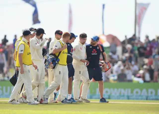 Rory Burns walks off the field after being hit by Dickwella