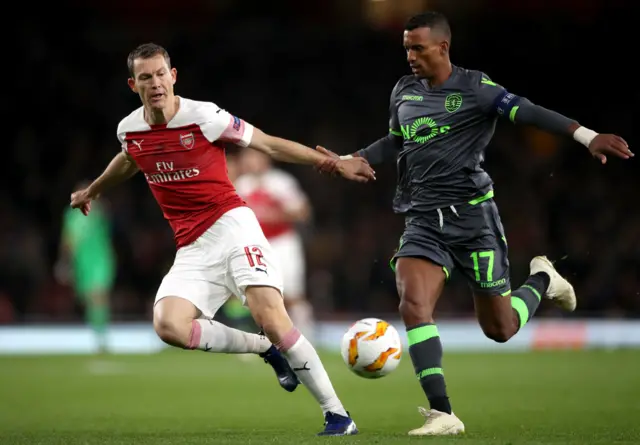 Arsenal's Stephan Lichtsteiner and Sporting's Nani