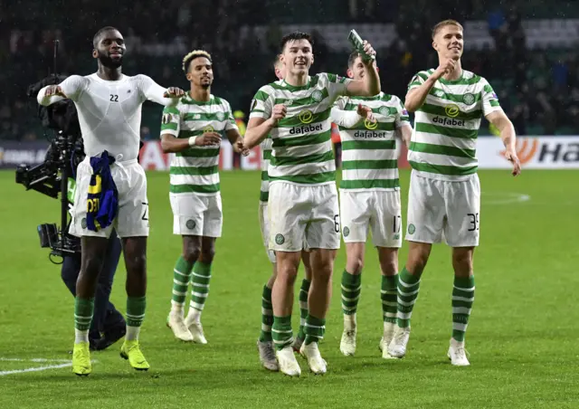 Celtic players celebrate at full-time.