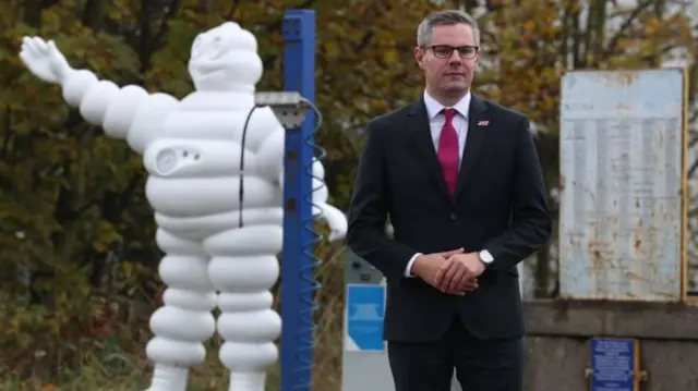 Derek Mackay outside Michelin