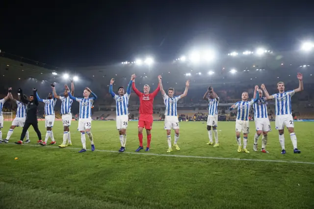 Huddersfield players celebrate following their victory over Fulham