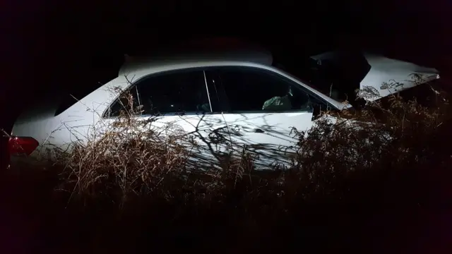 A crashed white car