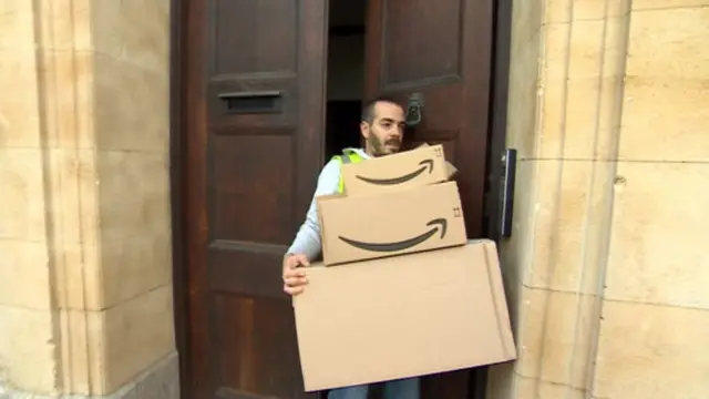 Catalin Dumitru carrying parcels