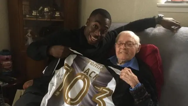 Two men and a signed Notts County shirt