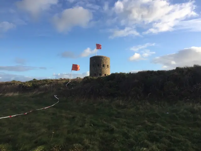 Flags flying from loophole tower