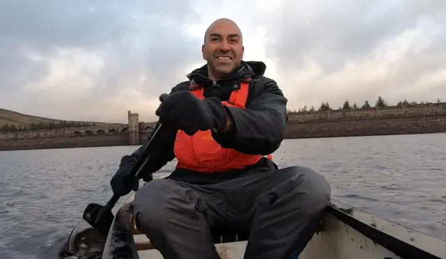 Amar Latif in a canoe