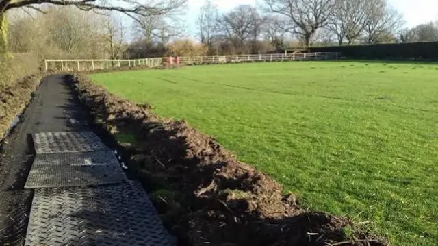 One of the running tracks being built