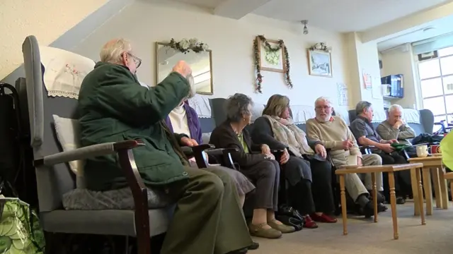 People talking at Age Concern