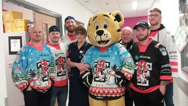 Tigers players and mascot