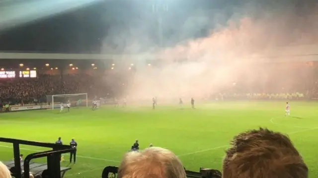 Smoke from the crowd during the game
