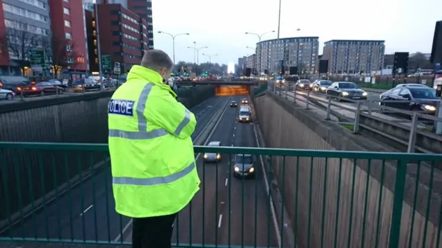 Police officer with speed gun