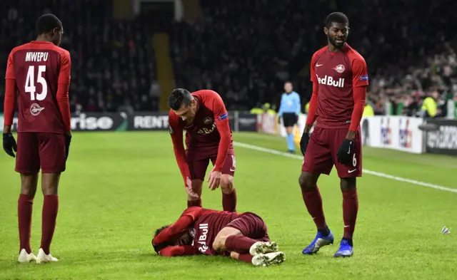 A Salzburg player appeared to be struck by something thrown from the crowd