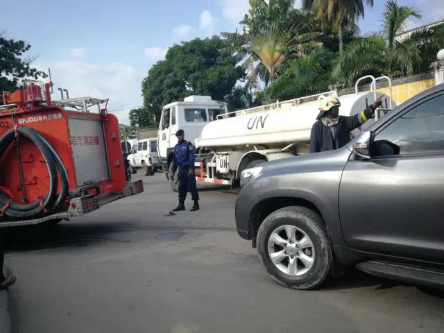 A fire engine and UN vehicle at the scene