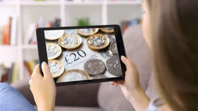 Tablet with a picture of pound coins