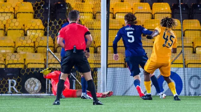 Livingston's Dolly Menga scores