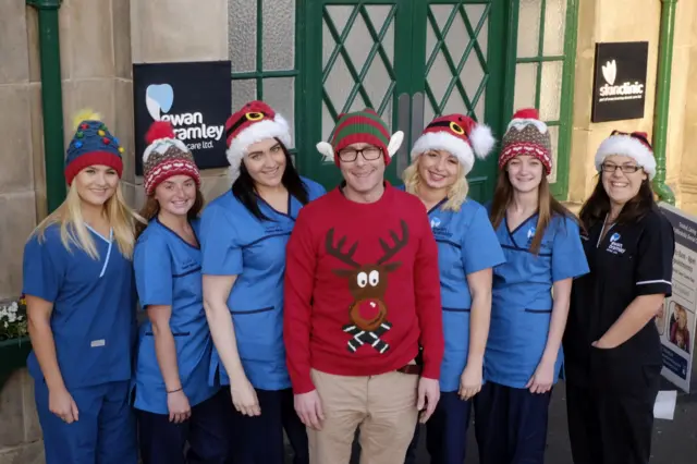 Ewan Bramley (centre) and some of his team feeling festive outside Ewan Bramley Dental Care on the Fish Quay