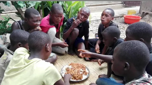 Street children eating in Burundi