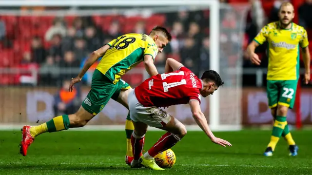 Callum O'Dowda is tackled by Norwich City's Marco Stiepermann