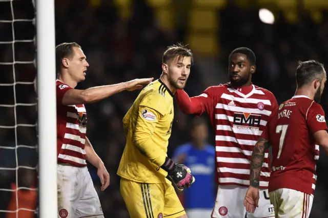 Gary Woods is congratulated by his team-mates after a string of good saves this afternoon