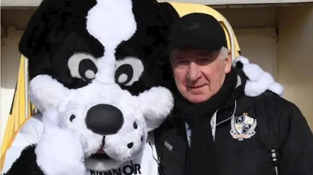 Errol Yorke with mascot Boomer