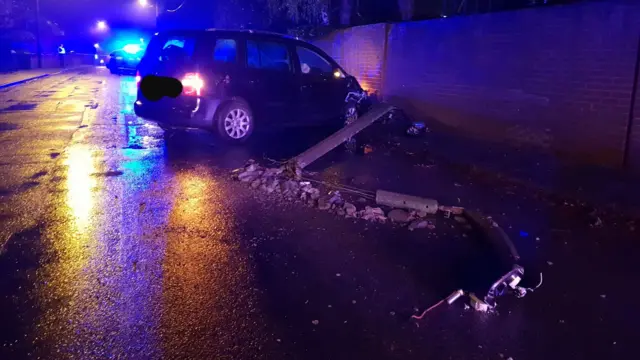 A car that's hit a lamppost