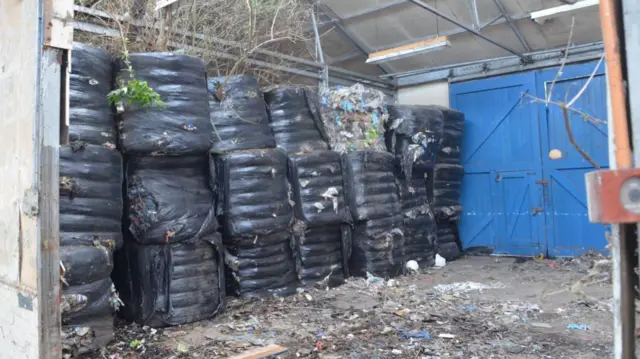 Bales of waste at the site