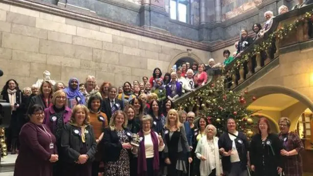 Women on the steps of the town hall