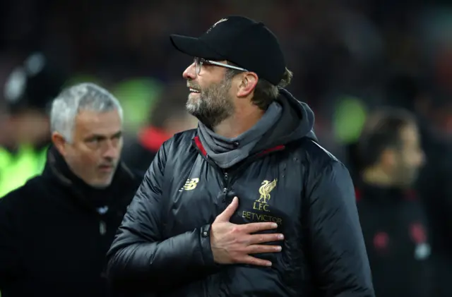 Jurgen Klopp with Jose Mourinho in the background