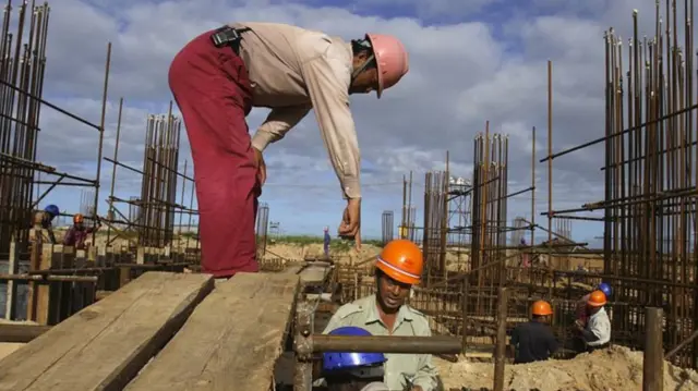 A Chinese supervisor gives instructions to fellow workers on the construction site of the National stadium in Zimpeto, Maputo - 2009