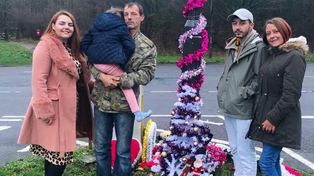 The family at the memorial