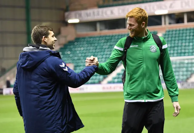 Former Liverpool teammates Jon Flanagan (left) and Adam Bogdan shake hands ahead of kick off