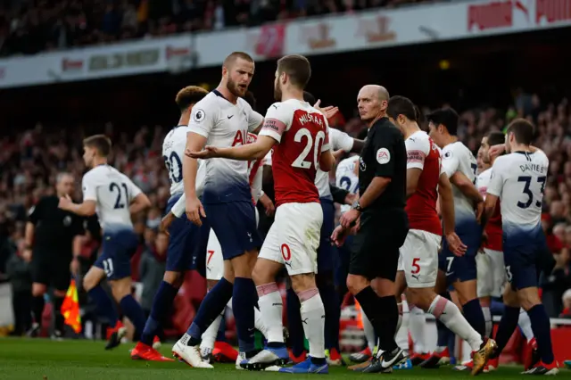 Arsenal players clash with Tottenham players