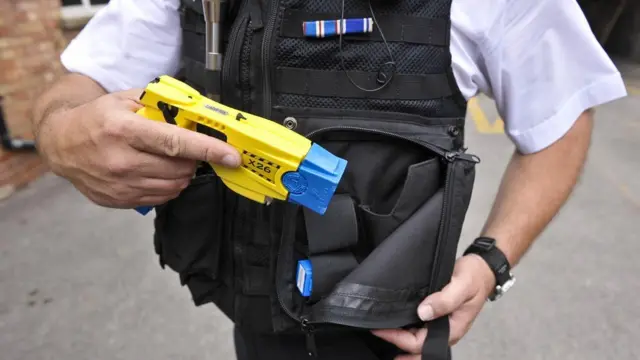 Officer holding Taser