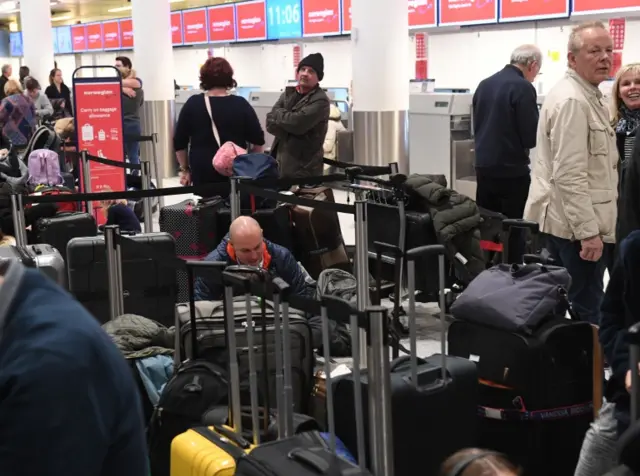 Suitcases fill Gatwick airport