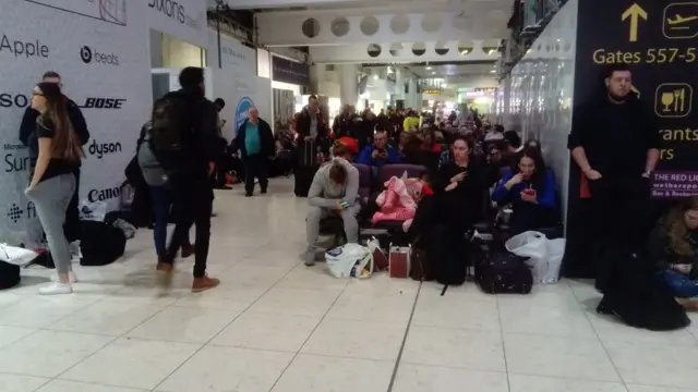 Passengers waiting for flights at Gatwick Airport