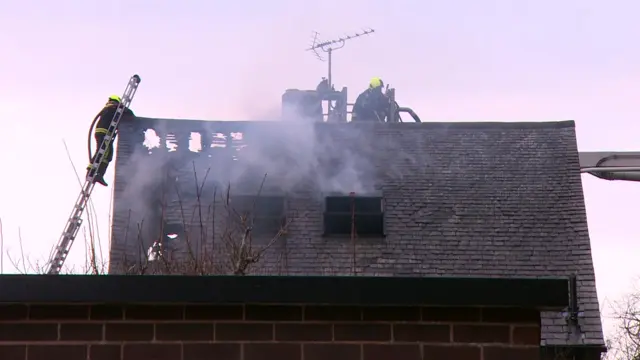 Firefighters tackle roof blaze