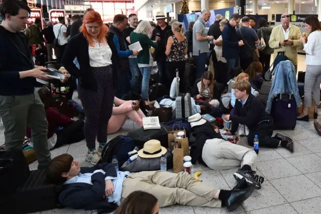 Passengers wait at Gatwick