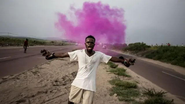 A man reacts as teargas fired in Kinshasa, DR Congo - 19 December 2018