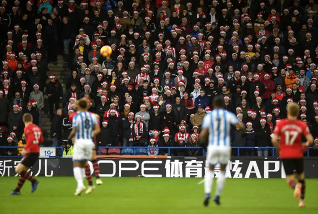 Southampton fans watch wearing Santa hats