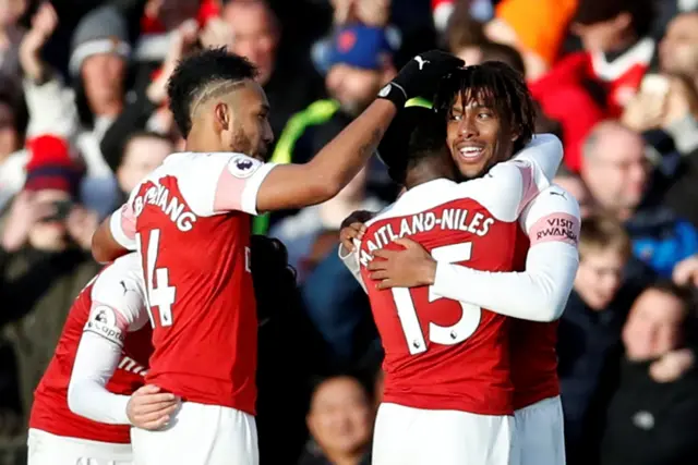 Iwobi celebrates with his team mates