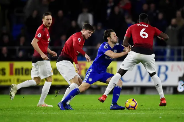 Harry Arter competes for the ball with Paul Pogba