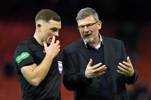 Hearts manager Craig Levein (right) with referee John Beaton after the match