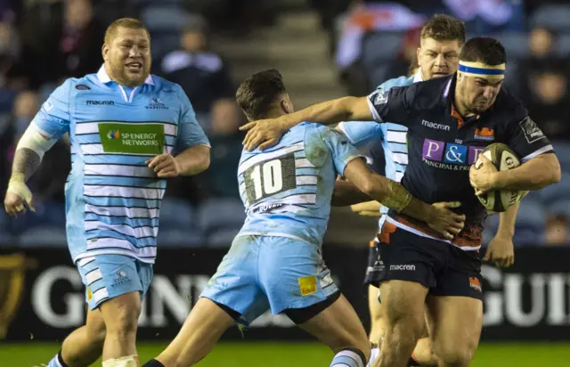 Edinburgh captain Stuart McInally slips away from Scotland team-mate Adam Hastings