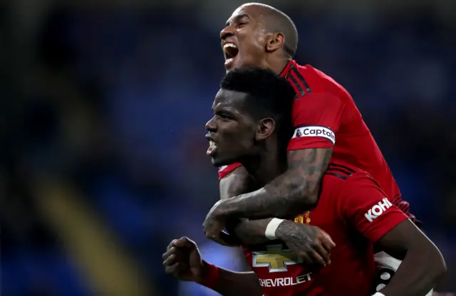 Paul Pogba and Ashley Young celebrate