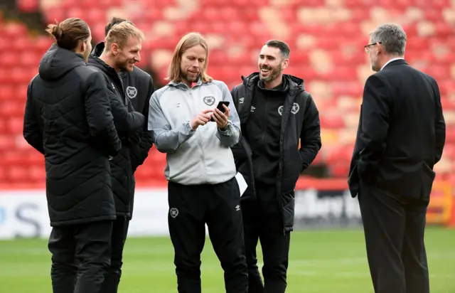 Hearts assistant manager Austin MacPhee and players share a moment