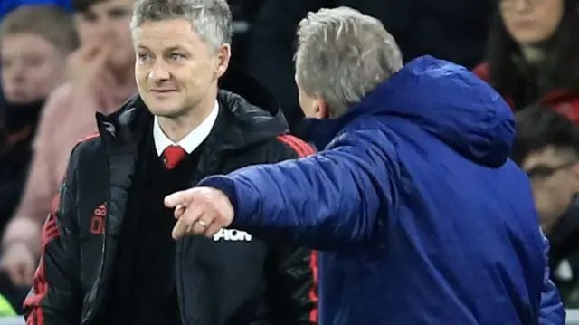 Neil Warnock talks to Ole Gunnar Solskjaer