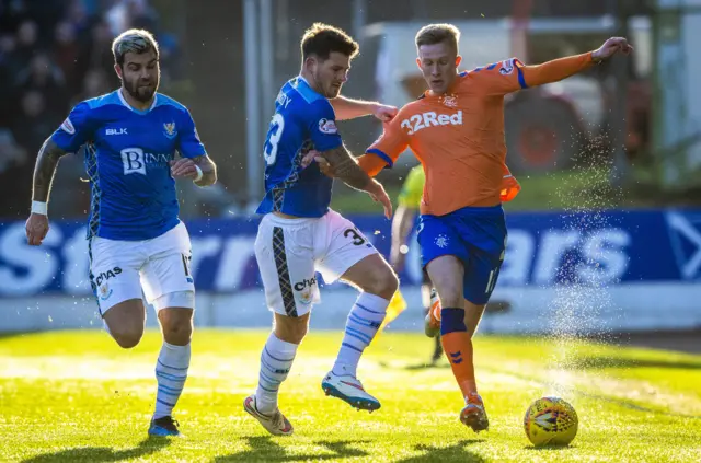 Rangers' Ross McCrorie holds off St Johnstone's Matty Kennedy and Richard Foster