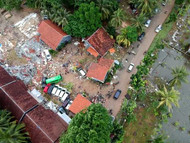 An aerial photo shows damaged buildings in Carita